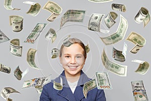 Joyful beautiful young girl child with cash dollar money on white background