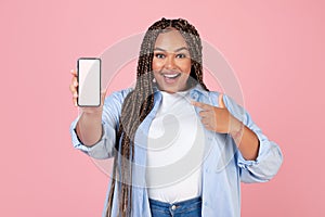 Joyful Black Lady Showing Mobie Phone Blank Screen, Pink Background