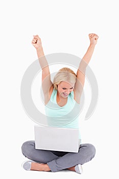 Joyful blond woman with a laptop