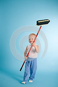 Joyful boy with cleaning swab over blue photo