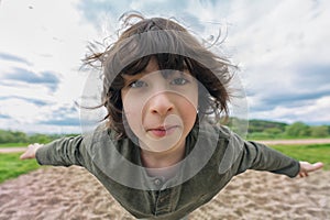 Joyful boy in flight levitation effect.