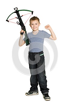 Joyful boy holding a crossbow