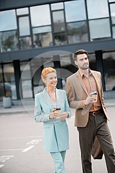 joyful business colleagues in stylish blazers