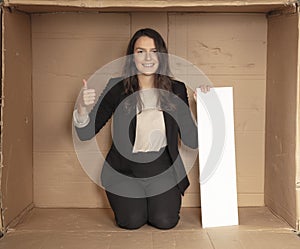 Joyful business woman with copy space sitting in her own office