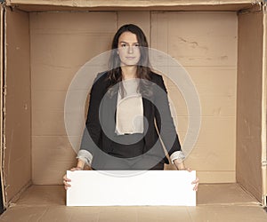 Joyful business woman with copy space sitting in her own office