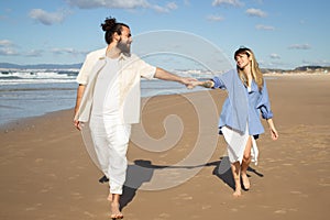 Joyful Caucasian couple having fun at seashore