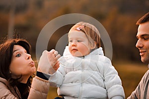 Joyful child, hay bale, mother's grassy jests