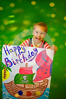Joyful child on his birthday drew a poster
