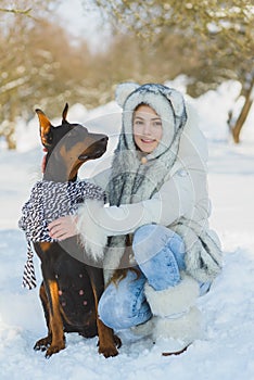 Joyful children playing in snow. Two happy girls having fun outside winter day