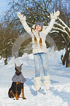 Joyful children playing in snow. Two happy girls having fun outside winter day