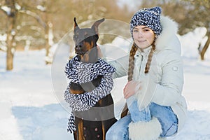 Joyful children playing in snow. Two happy girls having fun outside winter day