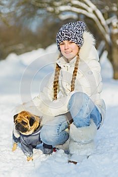 Joyful children playing in snow. Two happy girls having fun outside winter day