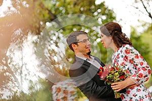 Joyful couple embracing outdoor