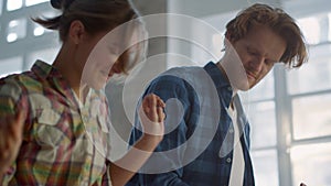 Joyful couple having fun during home repair indoors. Family dancing in house.