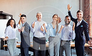 Joyful Coworkers Celebrating Success At Work Gesturing Posing In Office