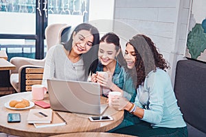 Joyful delighted women having a break from work