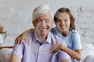 Joyful different generations male family looking at camera.