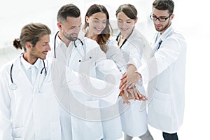 Joyful doctors are proud of their teamwork