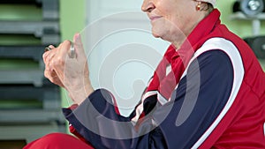 Joyful elderly woman having a fitness workout 4k