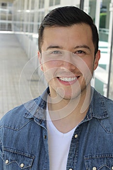 Joyful ethnic male smiling isolated