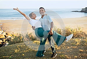 Joyful European Mature Spouses Having Fun Dancing At Ocean Outdoors