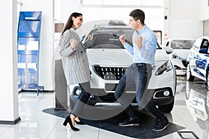 Joyful Family Couple Celebrating Buying First New Auto