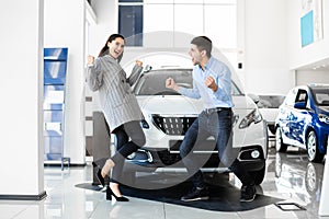 Joyful Family Couple Celebrating Buying New Auto