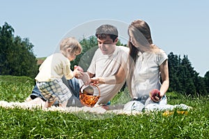 Joyful family picnicking