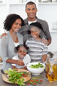 Joyful family preparing dinner