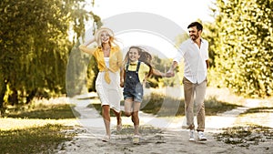 Joyful Family Running On Sunny Day Outdoors In Countryside, Panorama