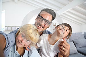 Joyful father and children having fun