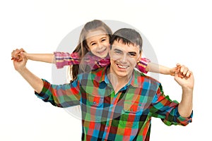 Joyful father with daughter on shoulders