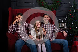 Joyful father with daughter and son in anticipation of a merry C