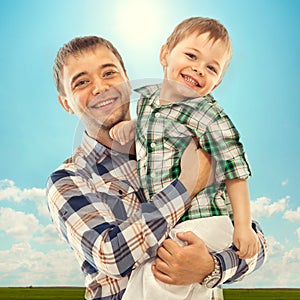 Joyful father with son carefree and happy