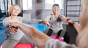 Joyful female friends enjoying their fitness workout