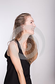 Joyful girl in a black dress