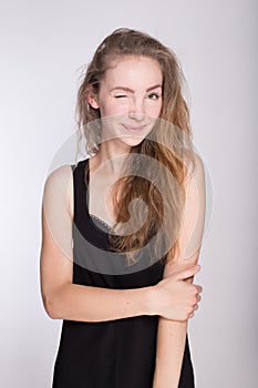 Joyful girl in a black dress