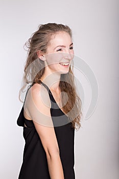 Joyful girl in a black dress