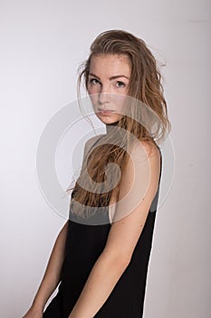 Joyful girl in a black dress