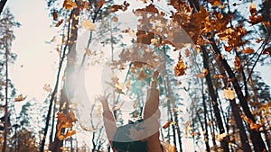 Joyful girl enjoying fall outdoor.