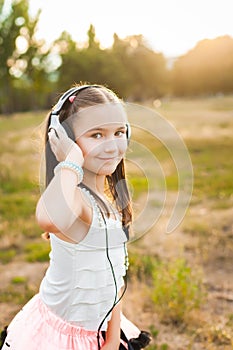 Joyful girl listening music