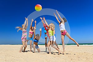 Joyful girls playing volleyball