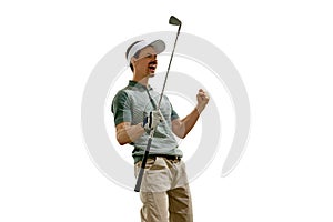 Joyful golfer in retro outfit and cap celebrating perfect goal with raised fist and golf club against white studio