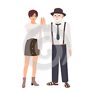 Joyful granddad and granddaughter giving high five. Smiling old man in hat and young teenage girl standing together