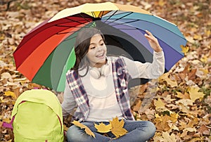 joyful greeting. autumn kid under colorful umbrella. feel the inspiration. happy childhood. back to school. girl with