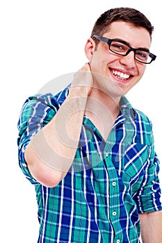 Joyful guy with hand on neck