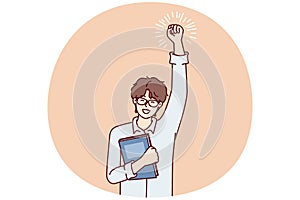 Joyful guy student with textbook in hand makes winning gesture after winning olympiad. Vector image photo