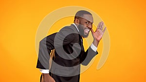 Joyful handsome afro-american man pretend running, black friday sale, discounts