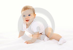 Joyful happy cute baby playing and crawls