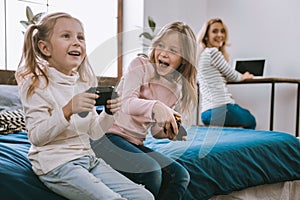 Joyful happy girls playing games